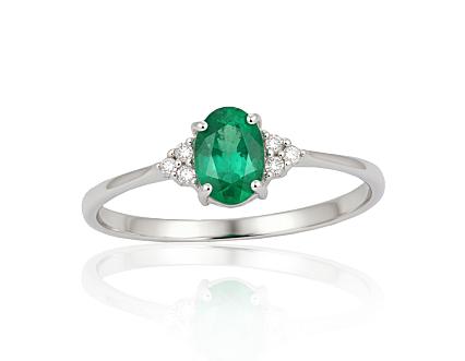 White gold ring with diamonds and an emerald