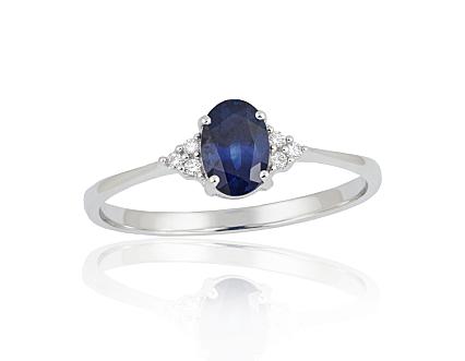 White gold ring with diamonds and a sapphire