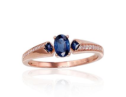 Red gold ring with diamonds and sapphires