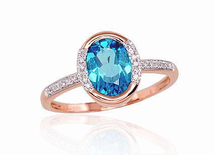 Red gold ring with diamonds and blue topazes