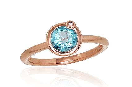 Ring aus Rotgold mit Diamant und blauem Topas