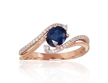 Red gold ring with diamonds and a sapphire