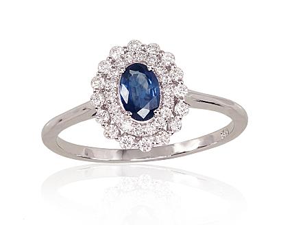 White gold ring with diamonds and a sapphire