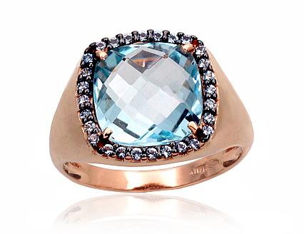Ring aus Rotgold mit Zirkonia und himmelblauen Topasen