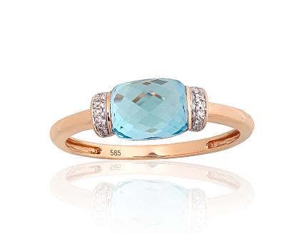 Ring aus Rotgold mit Diamanten und blauen Topasen