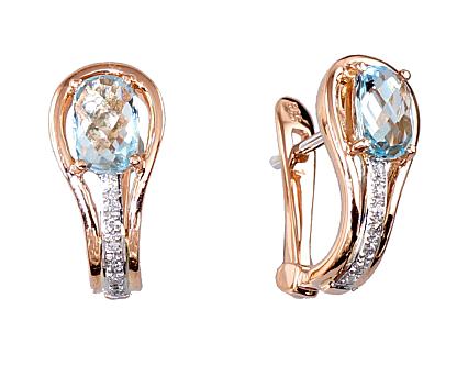 Red gold earrings with diamonds and sky-blue topazes