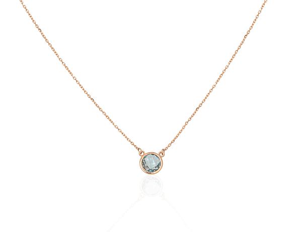 Collier aus Rotgold mit himmelblauen Topasen